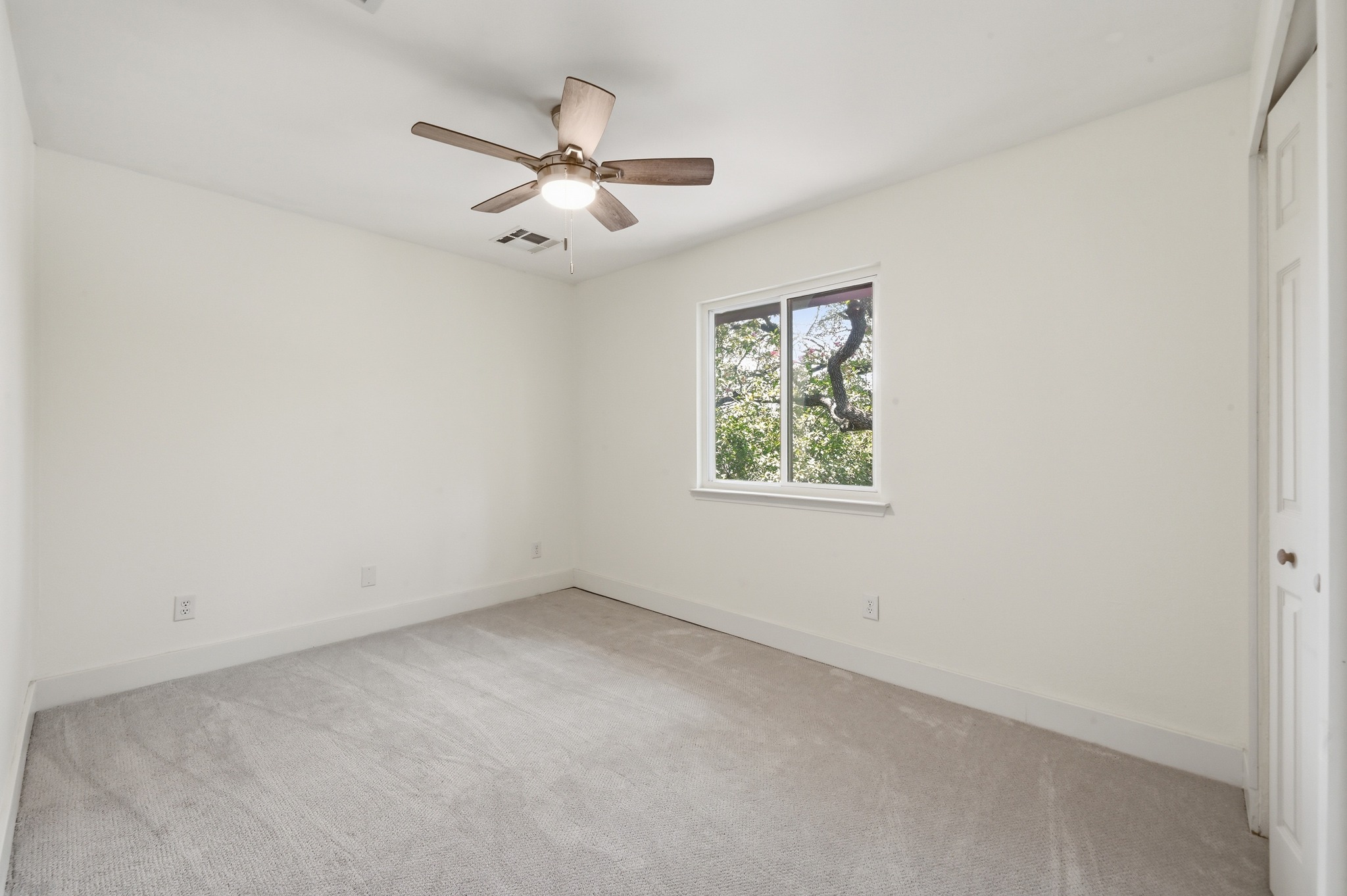 708 Shade Tree Drive Austin, TX 78748 - Photo 22 of 32 Both of the bedrooms come with updated ceiling fans, carpeting, and paint.