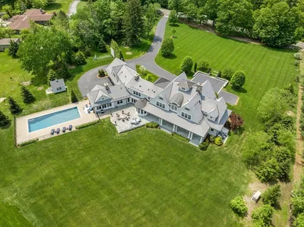 an aerial view of a house with a garden and outdoor space