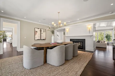 a living room with a couch and a chandelier