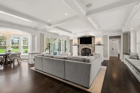 a living room with fireplace furniture and a flat screen tv