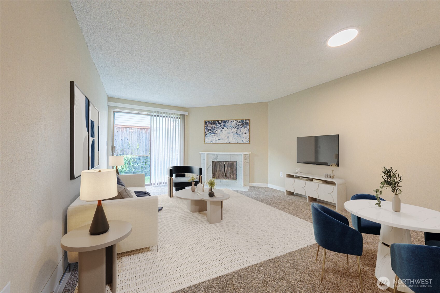 3302 I Street Northeast, Unit B103 Auburn, WA 98002 - Photo 6 of 23 a living room with furniture and a flat screen tv