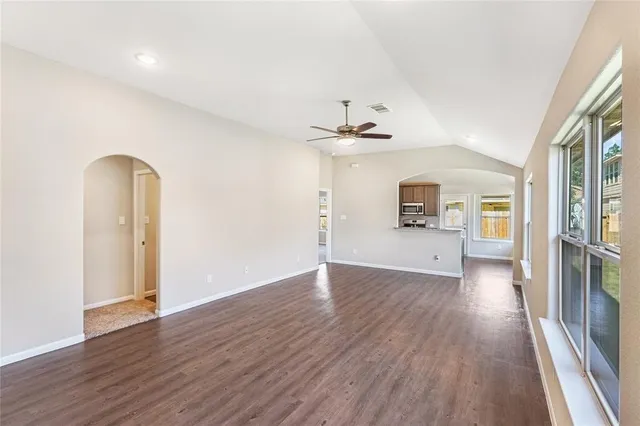 a view of a room with wooden floor