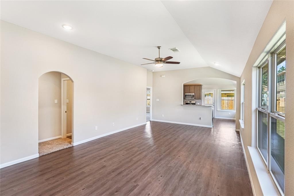 1821 Hidden Cedar Court Conroe, TX 77301 - Photo 2 of 10 a view of a room with wooden floor