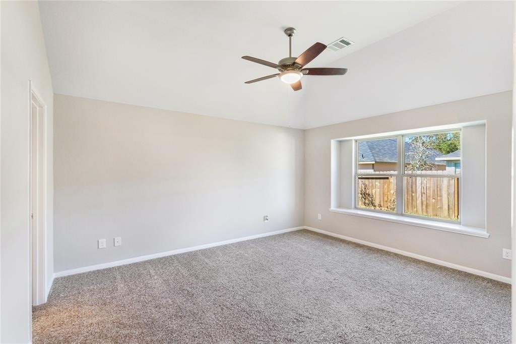 1821 Hidden Cedar Court Conroe, TX 77301 - Photo 5 of 10 a view of an empty room with a window