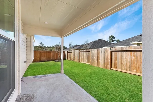 a view of a backyard with mountain view and a yard