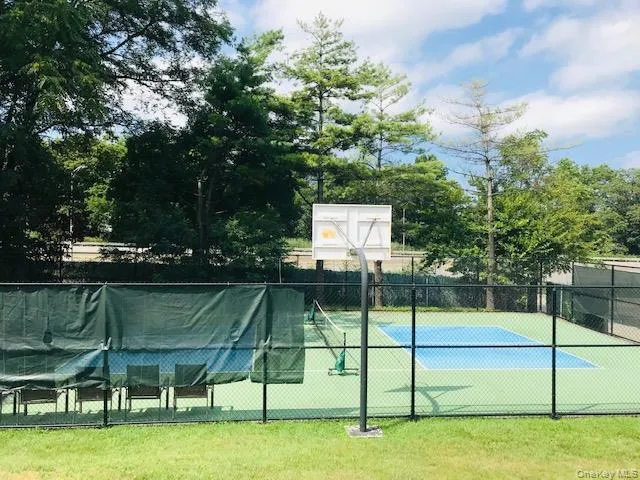 a view of a backyard with table and chairs