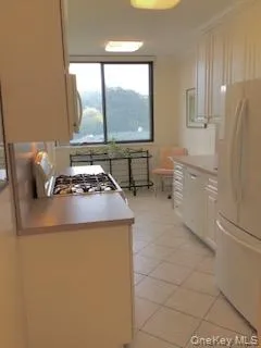 a kitchen with a stove a refrigerator and a sink