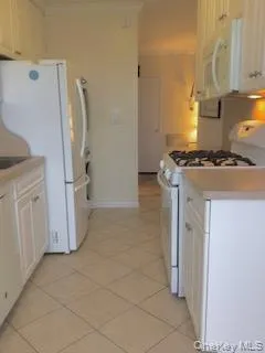 a kitchen with a stove a refrigerator and a stove