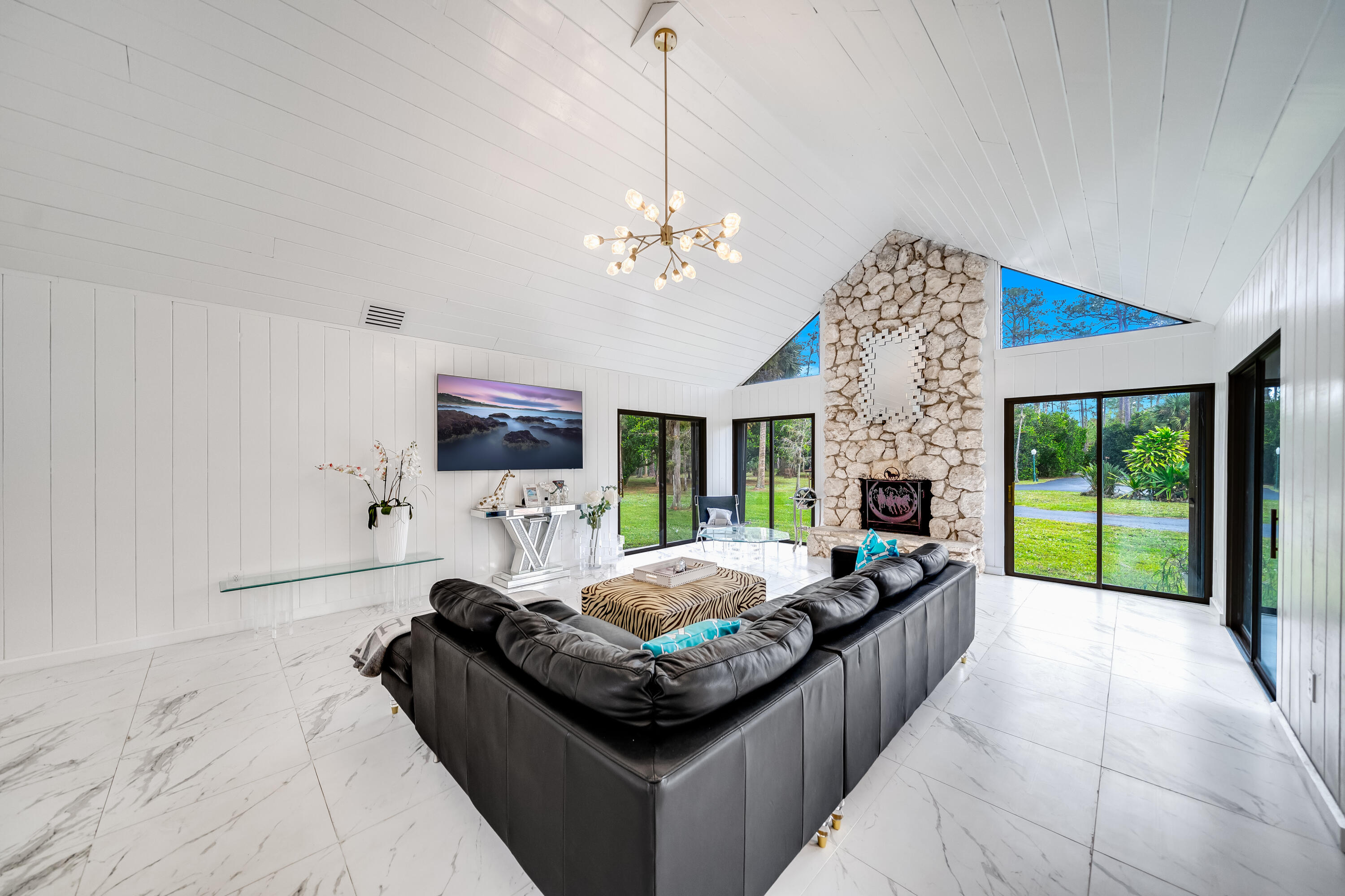 583 Rambling Dr Circle Wellington, FL 33414 - Photo 2 of 40 a living room with furniture fireplace and a large window