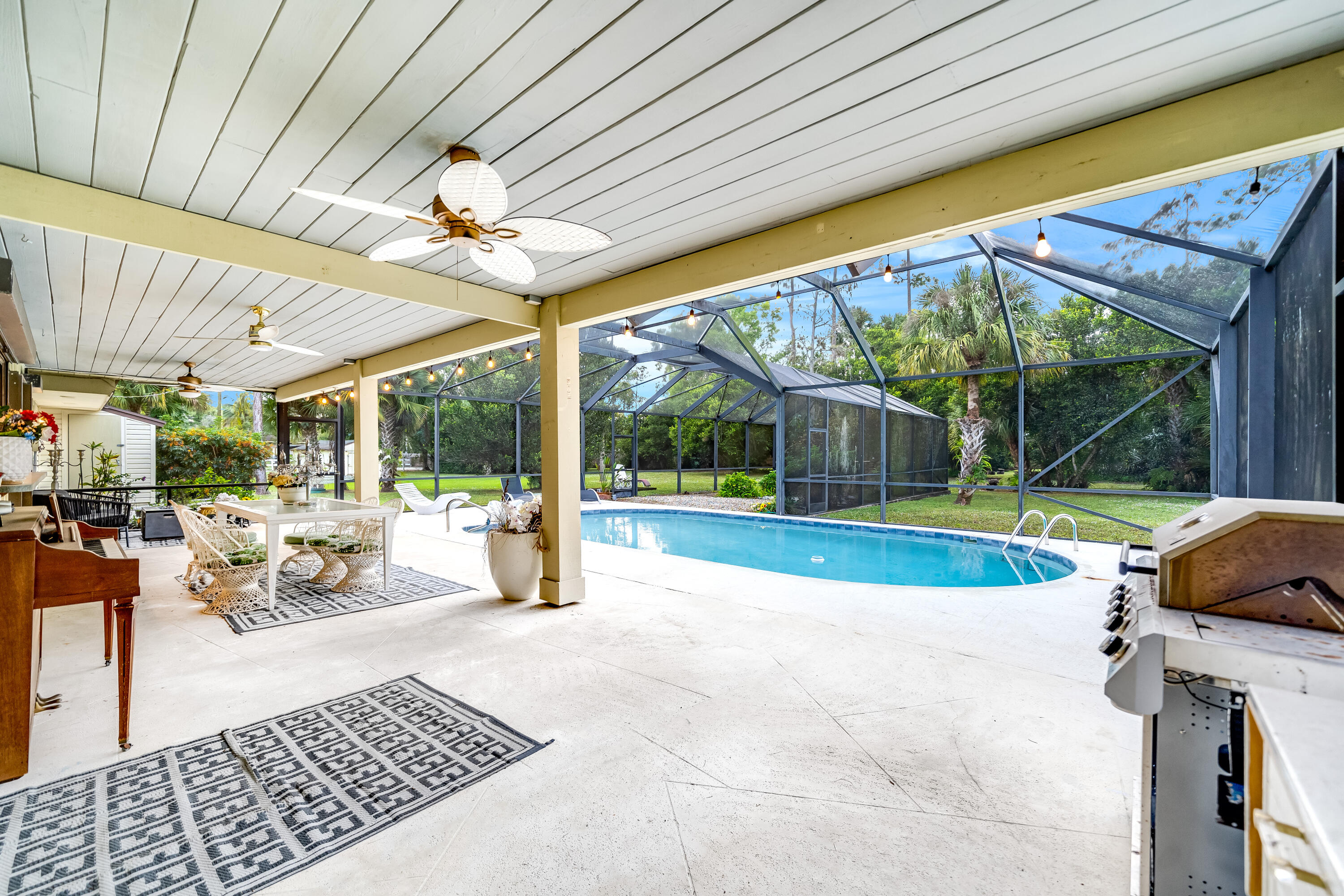 583 Rambling Dr Circle Wellington, FL 33414 - Photo 26 of 40 a view of a patio with couches table and chairs