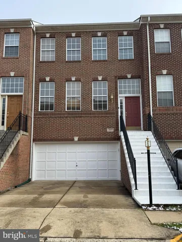 a view of front door of house with stairs