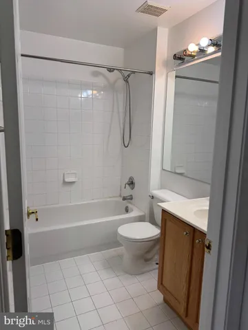a bathroom with a shower a bathtub and a sink