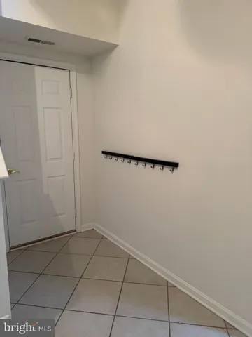 a view of a room with racks on the wall