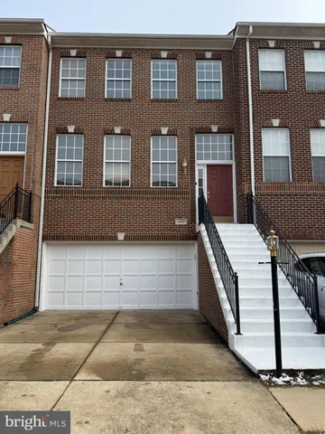 a view of a brick house with many windows