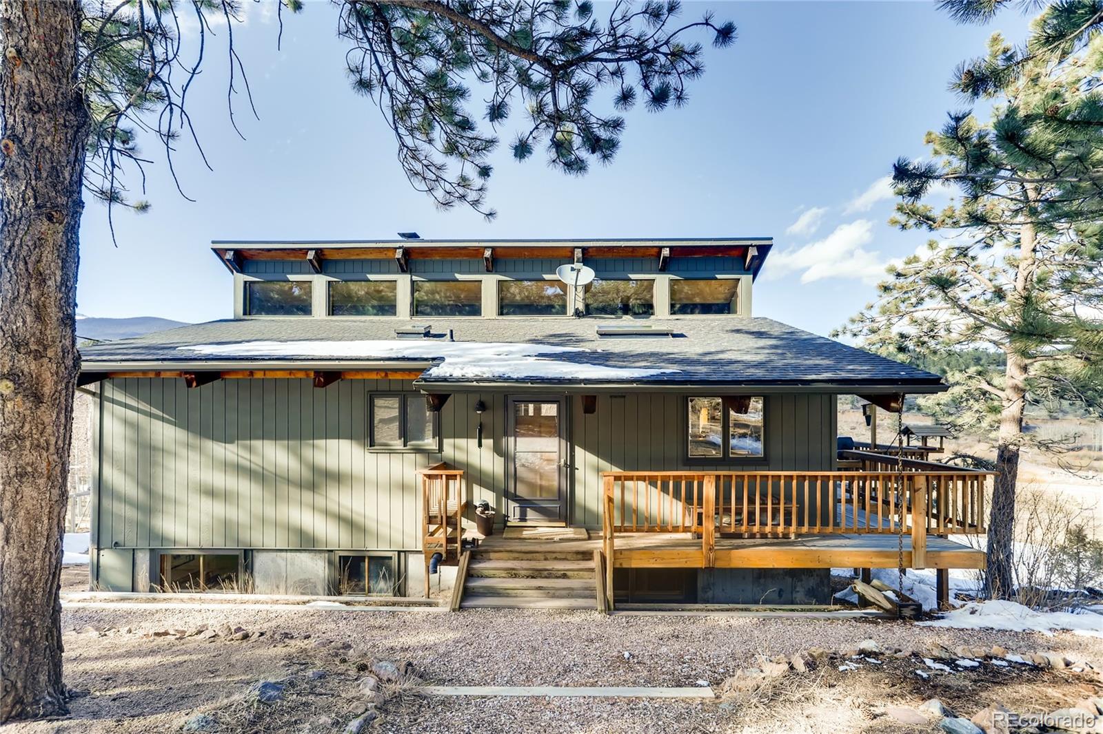 a view of a chairs and table on the deck