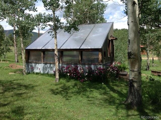 193 Twilight Terrace Drive Bailey, CO 80421 - Photo 31 of 34 a view of a house with a garden