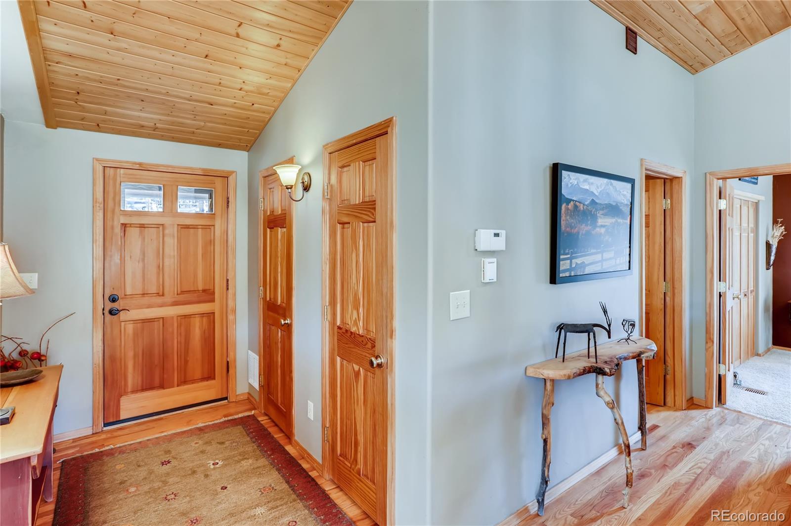 193 Twilight Terrace Drive Bailey, CO 80421 - Photo 4 of 34 a view of a hallway with furniture and entryway