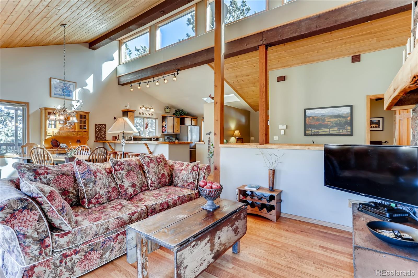 193 Twilight Terrace Drive Bailey, CO 80421 - Photo 6 of 34 a living room with furniture and a flat screen tv