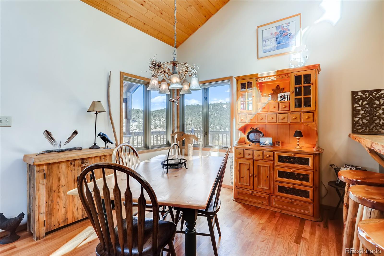 193 Twilight Terrace Drive Bailey, CO 80421 - Photo 7 of 34 a view of a dining room with furniture and wooden floor