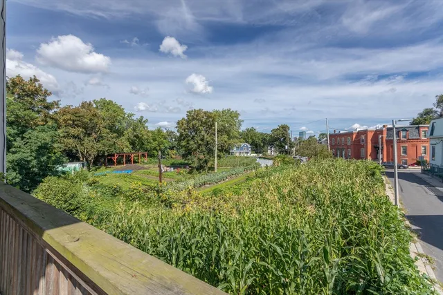 a view of a garden from a balcony
