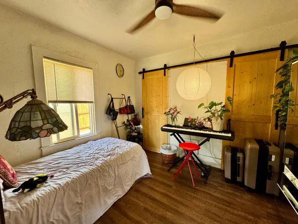 a bedroom with a bed and a table