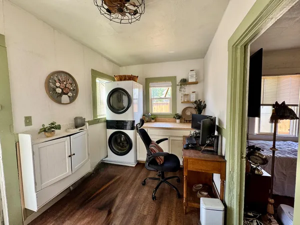 a view of a hallway with washer and dryer