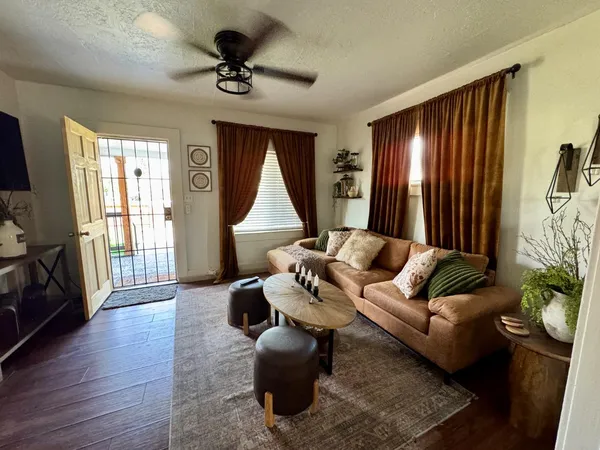a living room with furniture and a large window