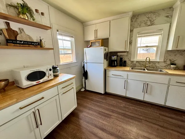 a kitchen with a sink and cabinets