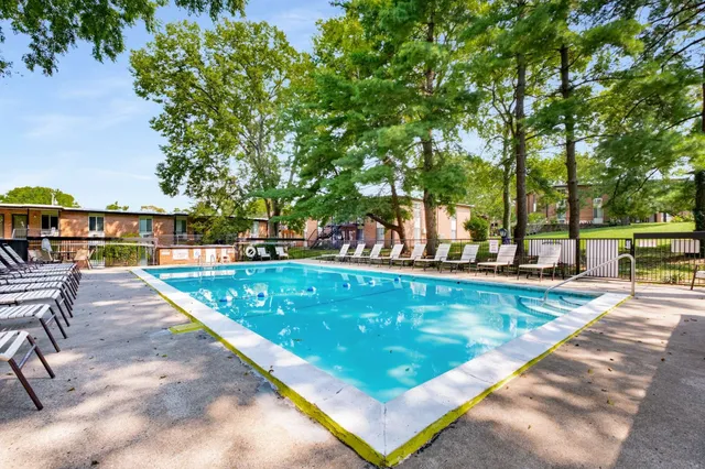 a backyard of a house with outdoor seating