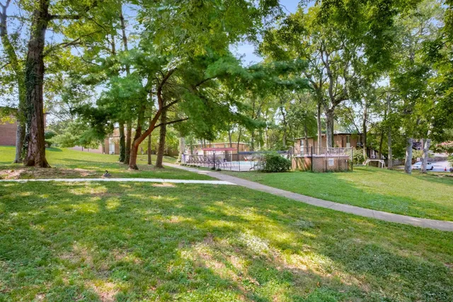 a view of street with parked cars