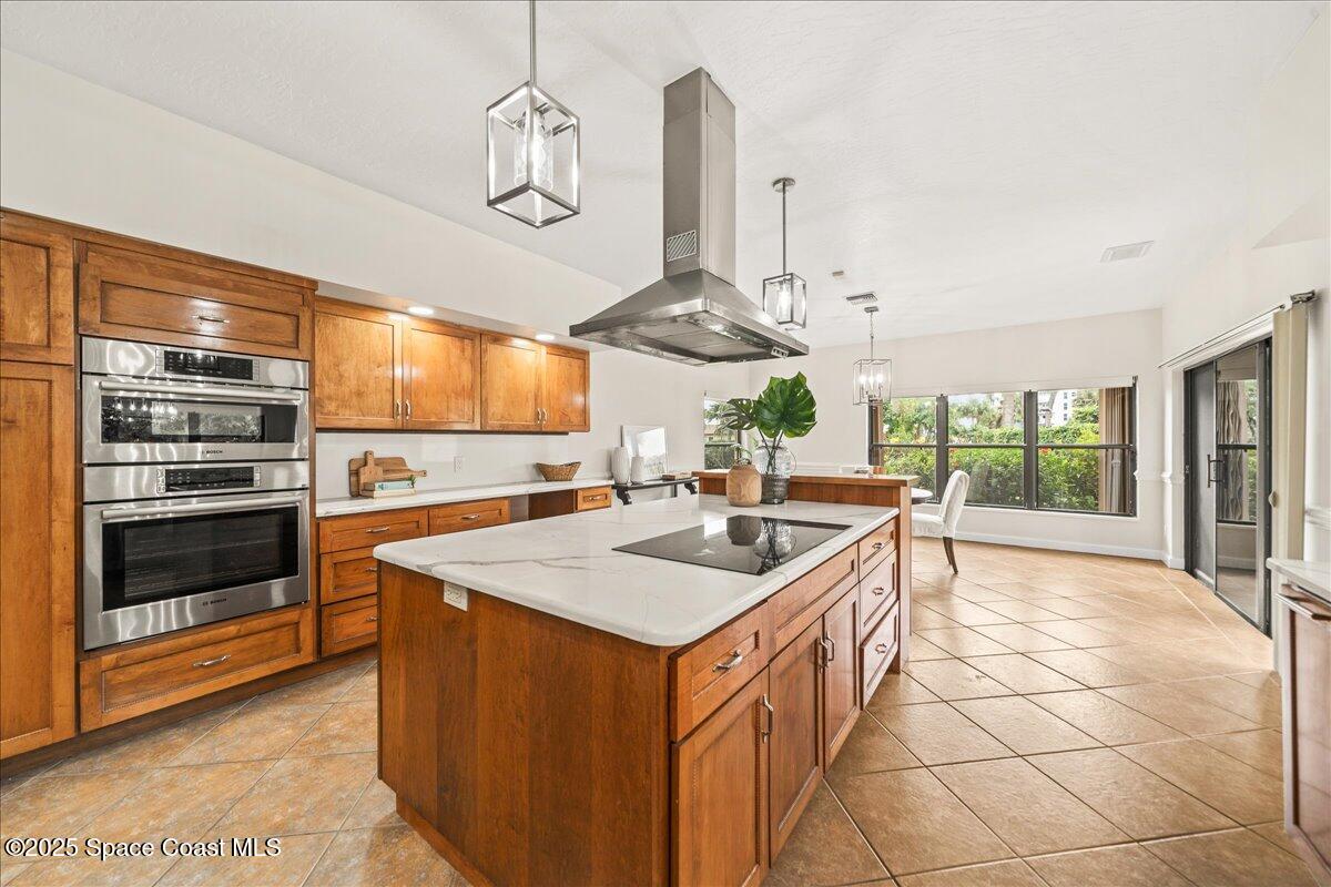 208 The Road, Unit C2 Melbourne Beach, FL 32951 - Photo 11 of 65 a kitchen with stainless steel appliances granite countertop a sink and a stove