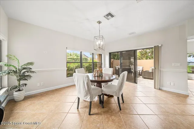 a spacious bathroom with a granite countertop sink mirror and a bathtub