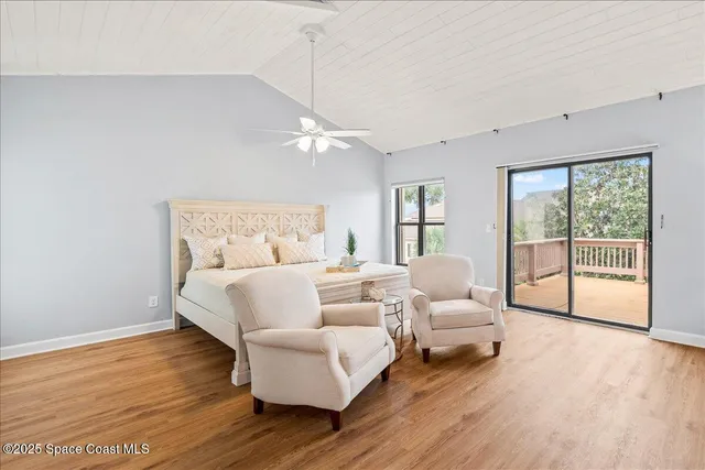 a view of a livingroom with wooden floor and cabinet