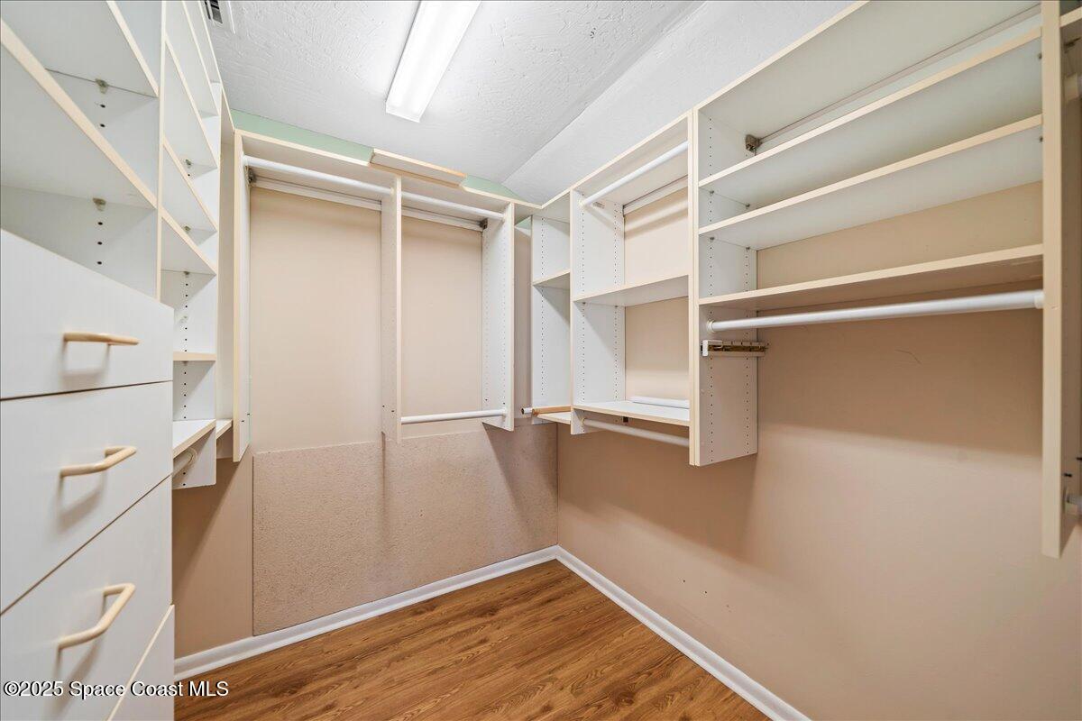 208 The Road, Unit C2 Melbourne Beach, FL 32951 - Photo 25 of 65 a view of walk in closet with empty racks