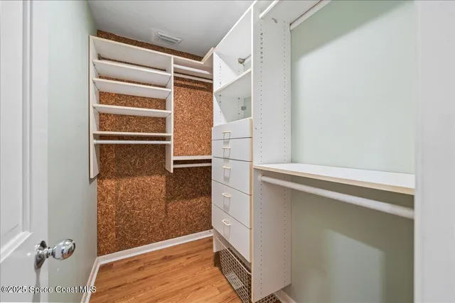 a view of a porch with wooden floor and furniture