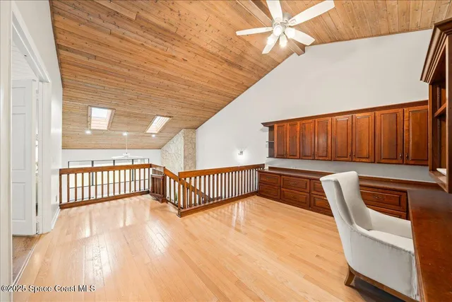 a view of a garden with a building in the background