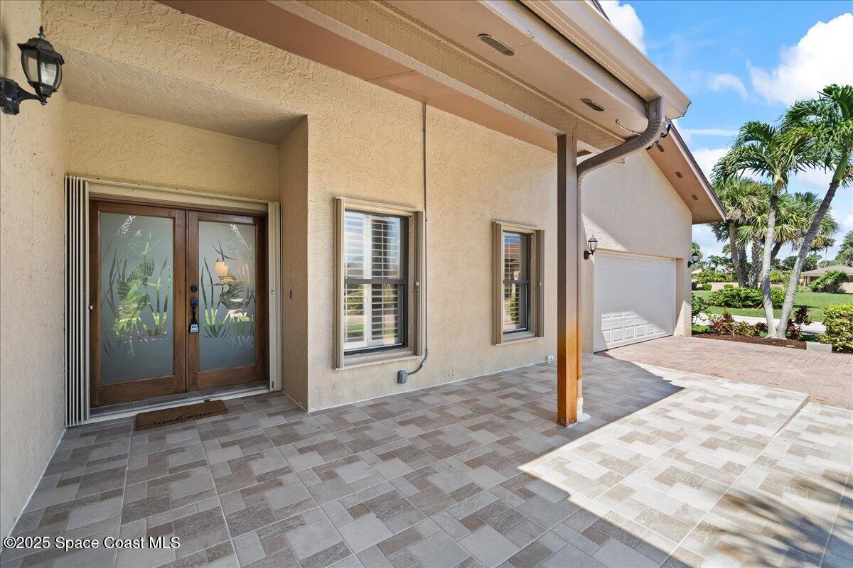 208 The Road, Unit C2 Melbourne Beach, FL 32951 - Photo 4 of 65 a view of a entrance