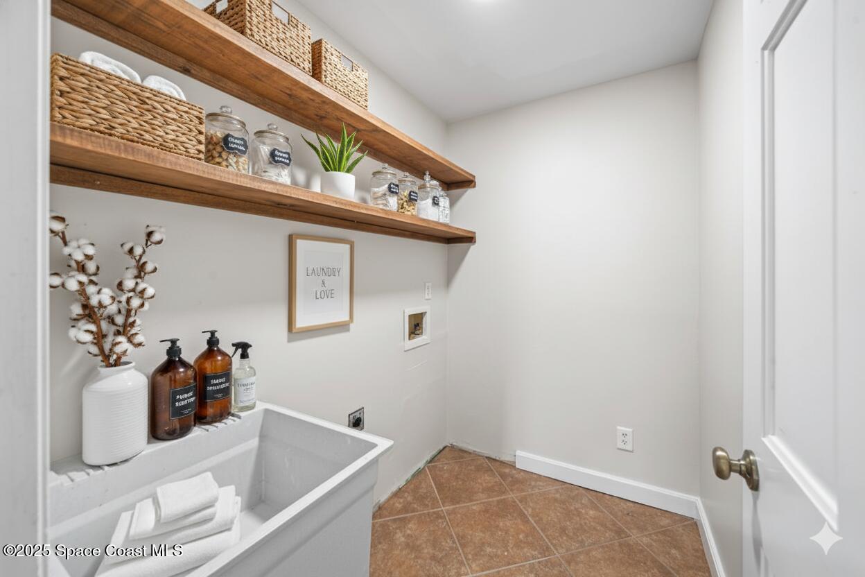 208 The Road, Unit C2 Melbourne Beach, FL 32951 - Photo 42 of 65 a bathroom with a tub and sink