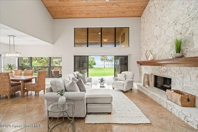 a kitchen with kitchen island granite countertop a sink a counter top space appliances and cabinets
