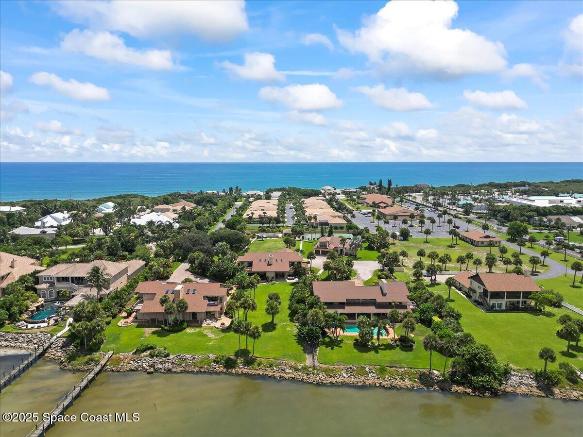 208 The Road, Unit C2 Melbourne Beach, FL 32951 - Photo 61 of 65 an aerial view of residential houses with lake view and mountain view in back