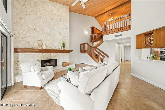 a dining room with furniture and a floor to ceiling window