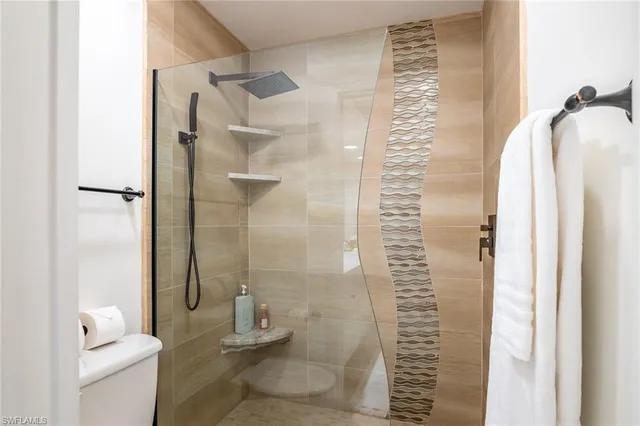 a bathroom with a shower and a toilet