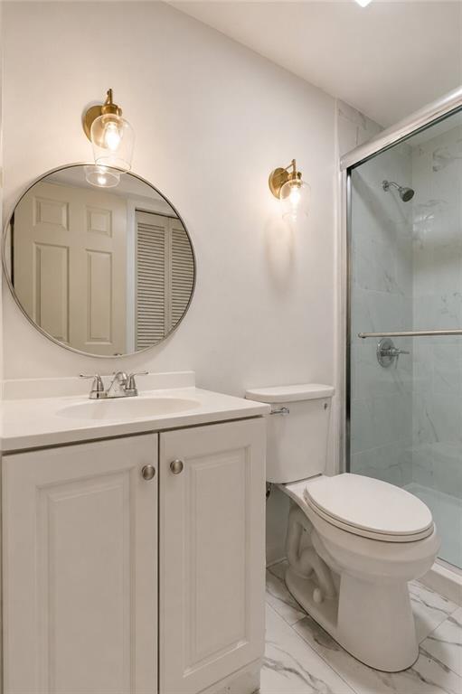750 Washington Road, Unit 307 Pittsburgh, PA 15228 - Photo 12 of 24 a bathroom with a sink a toilet and shower