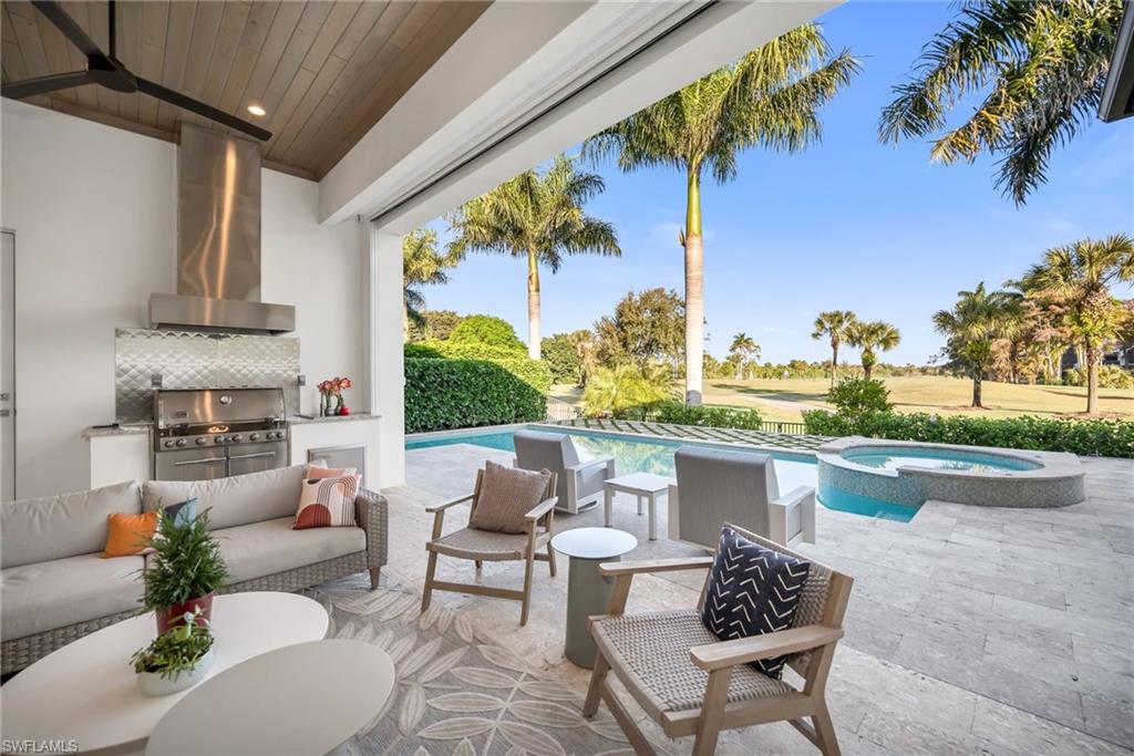 1671 Vinland Way Naples, FL 34105 - Photo 12 of 50 a living room with patio furniture and a potted plant
