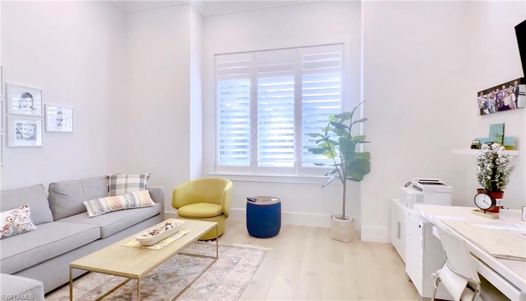 1671 Vinland Way Naples, FL 34105 - Photo 18 of 50 a living room with furniture and a potted plant
