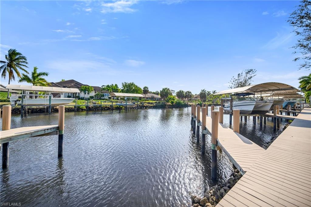 1671 Vinland Way Naples, FL 34105 - Photo 28 of 50 a view of a lake with houses