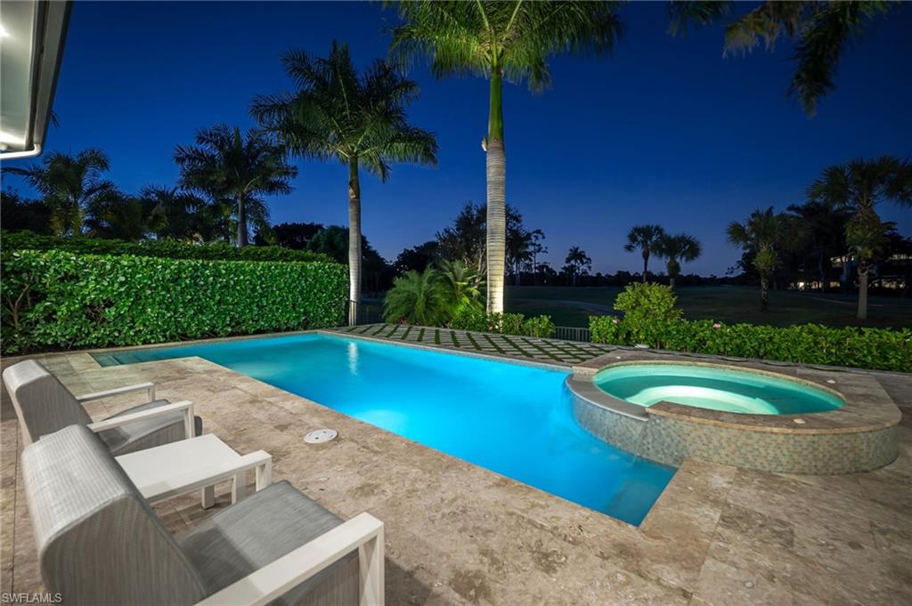 1671 Vinland Way Naples, FL 34105 - Photo 3 of 50 a view of a swimming pool with a patio