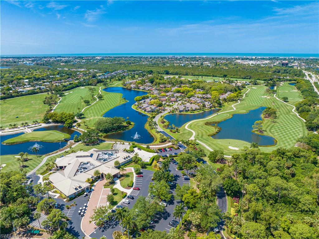 1671 Vinland Way Naples, FL 34105 - Photo 35 of 50 an aerial view of residential houses with outdoor space
