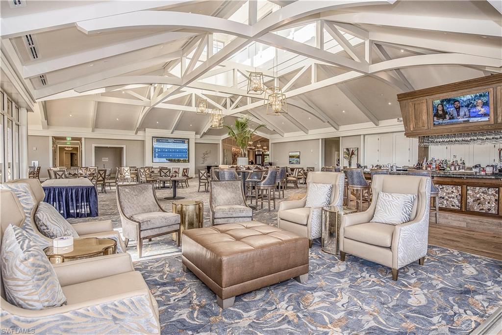 1671 Vinland Way Naples, FL 34105 - Photo 38 of 50 a living room with lots of furniture and white walls