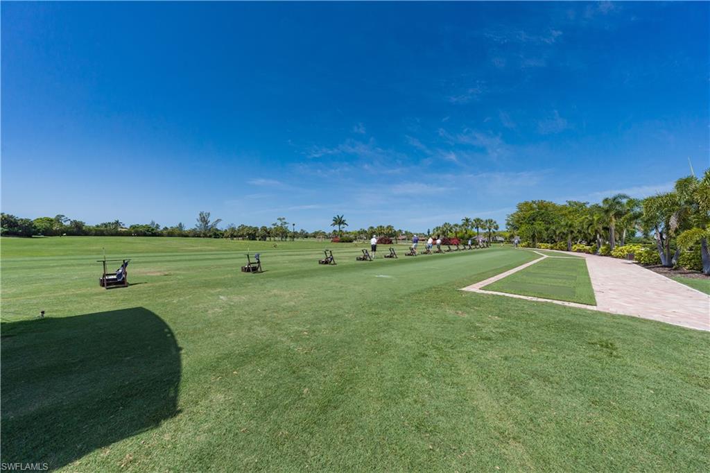 1671 Vinland Way Naples, FL 34105 - Photo 44 of 50 a view of a golf course with a lake
